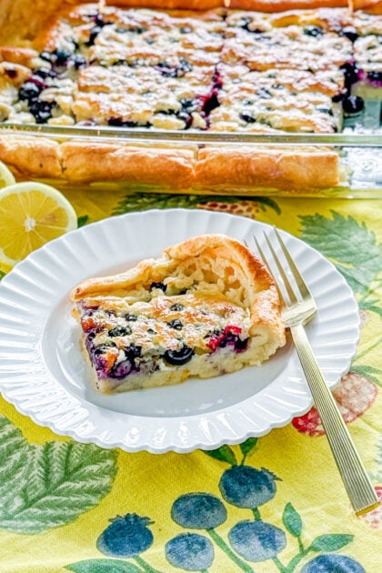Close-up of a lemon blueberry Dutch baby with fresh blueberries