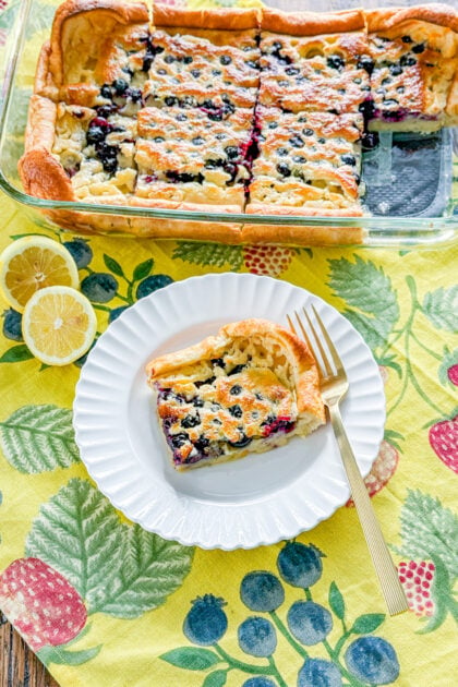 Slice of lemon blueberry Dutch baby made with fresh blueberries and lemon