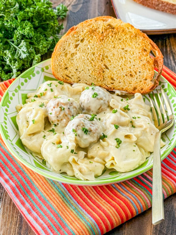 Slow cooker creamy meatballs with tortellini in a creamy sauce