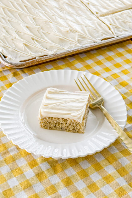 Banana bars baked in a jelly roll pan with cream cheese frosting