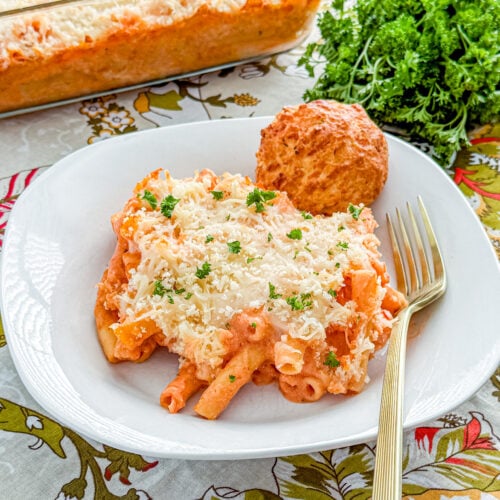 Close-up of baked five cheese ziti al forno with marinara, Alfredo, and melted cheese
