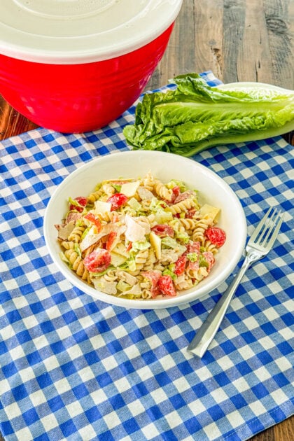 Italian grinder pasta salad with deli meats, provolone, lettuce, tomatoes, and creamy dressing