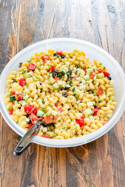 Italian pasta salad mixed together before chilling in the refrigerator