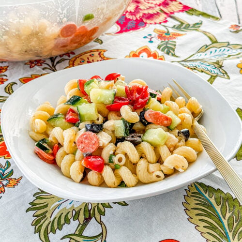 Easy Italian pasta salad tossed with Italian dressing, mozzarella, and fresh vegetables