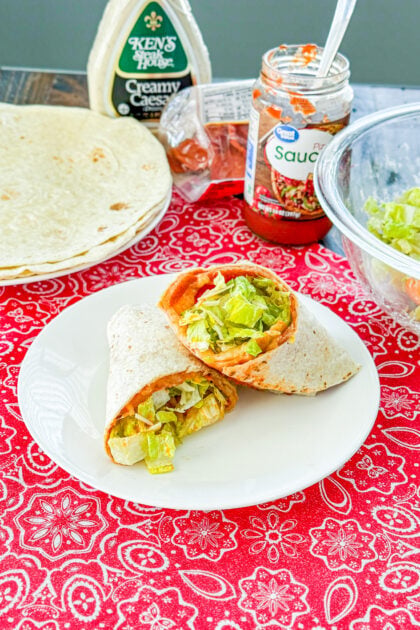 Pizza salad wrap with pepperoni, melted cheese, and Caesar salad