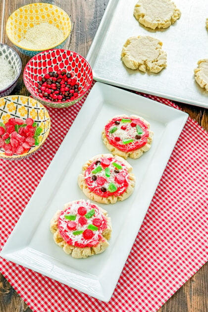 Overhead view of sugar cookies decorated like mini pizzas