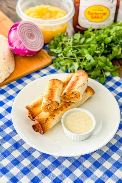 Overhead view of BBQ chicken flautas on a plate