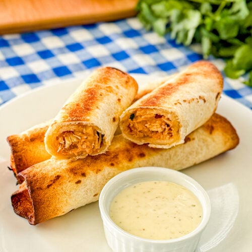 Close-up of crispy BBQ chicken flautas