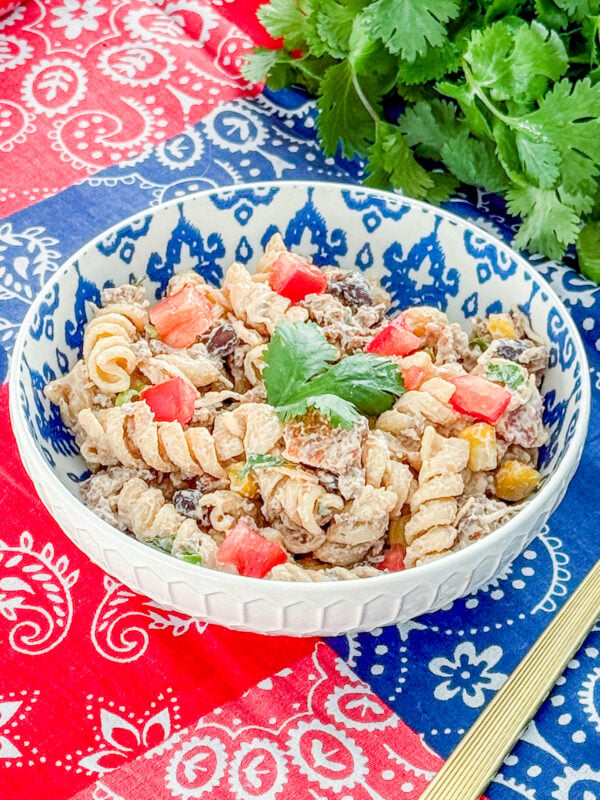 Close-up of healthy cowboy pasta salad with beef, bacon, beans, and corn