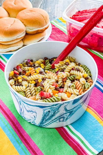 Southwestern pasta salad with tricolor rotini, corn, black beans, tomatoes, and green chilies