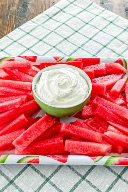 Fluffy fruit dip made with marshmallow creme, cream cheese, and Cool Whip