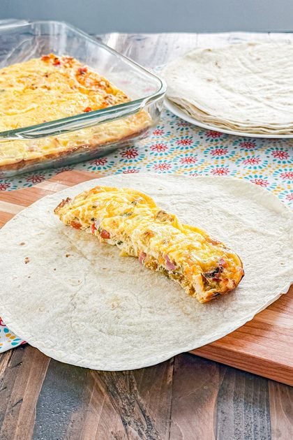 Baked breakfast burrito filling cut into portions for wrapping in tortillas
