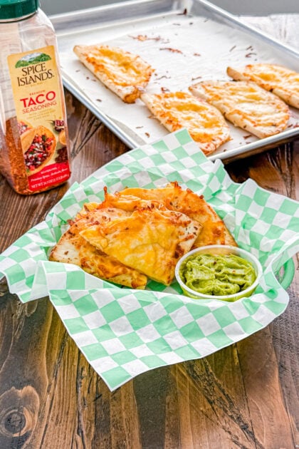 Baked chicken quesadillas filled with seasoned chicken and melted cheddar and Monterey Jack cheese