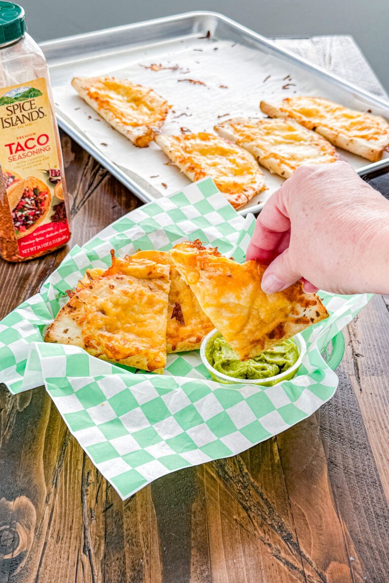 Crispy chicken quesadilla wedge served with guacamole for dipping