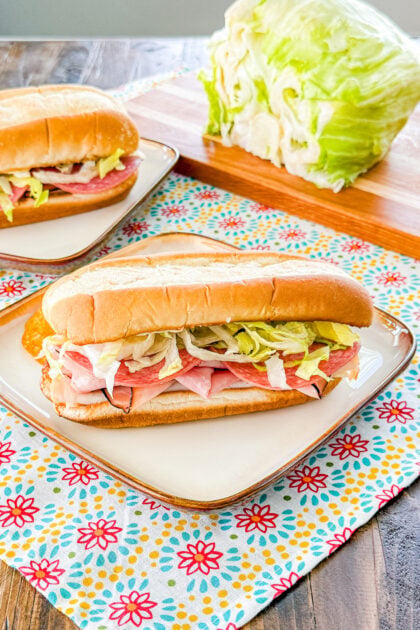 Sub roll layered with Italian deli meats, provolone cheese, and lettuce