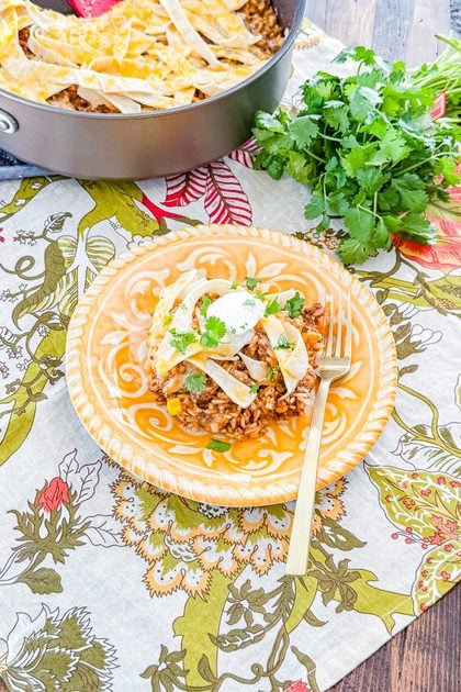 Overhead view of one-pan beef enchilada rice skillet topped with melted cheese