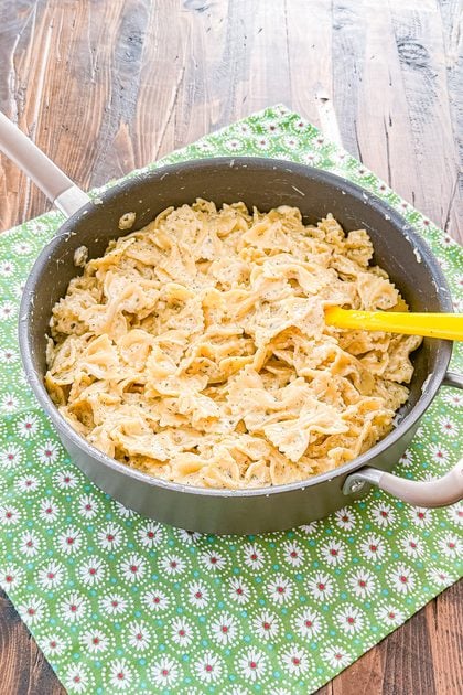 Garlic butter pasta cooked in a skillet with chicken broth, cream, and herbs