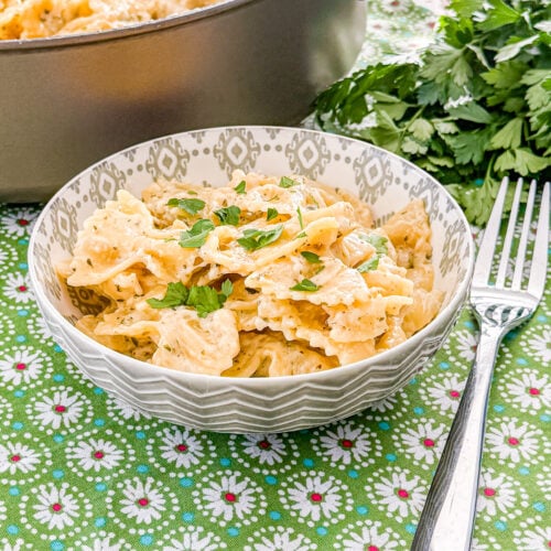 Close-up of garlic butter pasta coated in a creamy Parmesan herb sauce