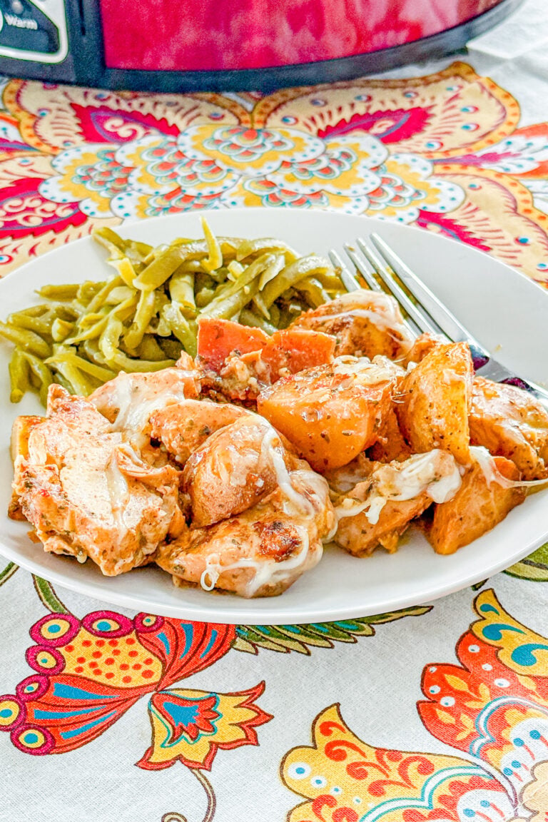 Slow Cooker Garlic Parmesan Chicken and Potatoes with melted mozzarella cheese