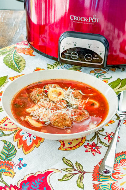 low Cooker Meatball Tortellini Soup with Italian meatballs, cheese tortellini, tomatoes, spinach, and Parmesan