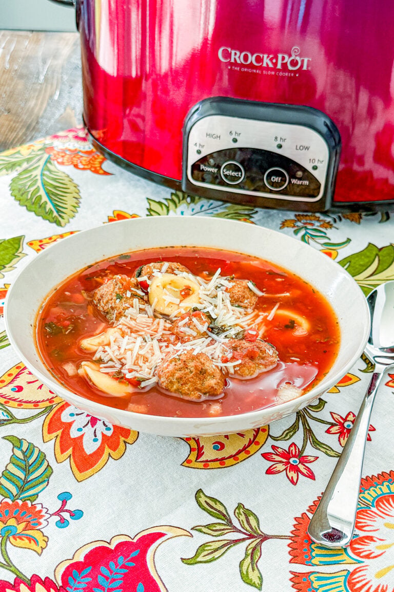 low Cooker Meatball Tortellini Soup with Italian meatballs, cheese tortellini, tomatoes, spinach, and Parmesan