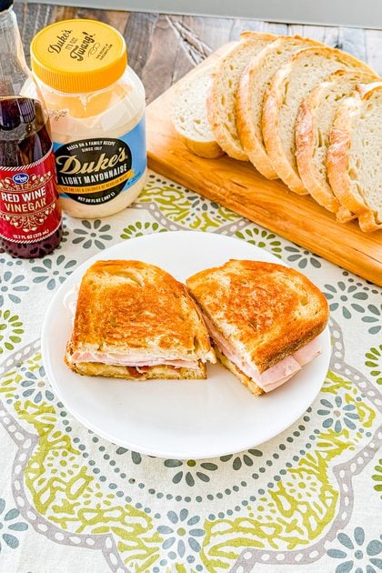 Grilled sourdough turkey bacon sandwiches served with melted cheese and tomato