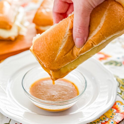 Turkey French dip sandwiches with deli turkey, melted provolone, and herb gravy for dipping