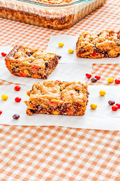 Easy peanut butter blondies with Reese’s Pieces and chocolate chips
